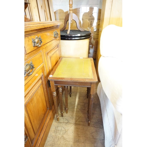 212 - A nest of 3 leather topped tables