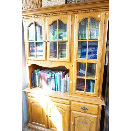 233 - A glazed sideboard over a cupboard base