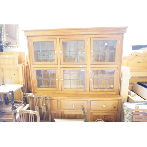26 - A pine dresser with leaded glazed doors