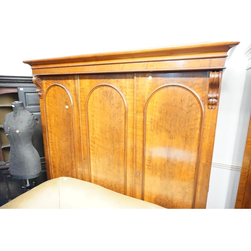 301 - A triple doored Victorian mahogany compendium wardrobe