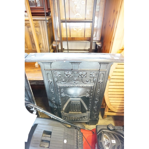 42 - A decorative Arts & Crafts period iron work fire surround