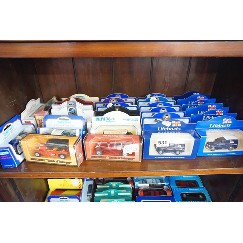 531 - A collection of boxed model vehicles - (top shelf)