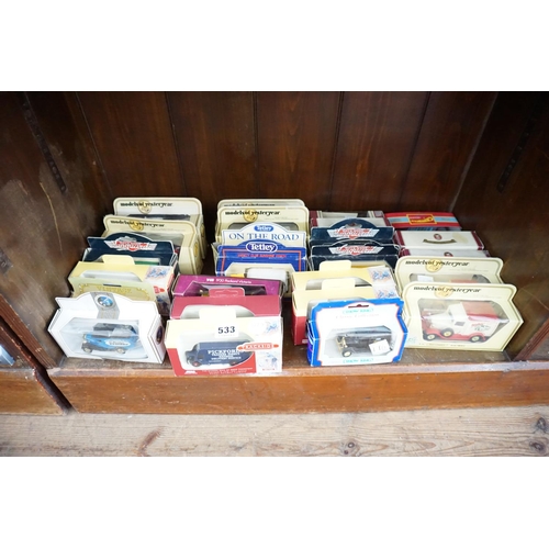533 - A collection of boxed model vehicles (bottom shelf)