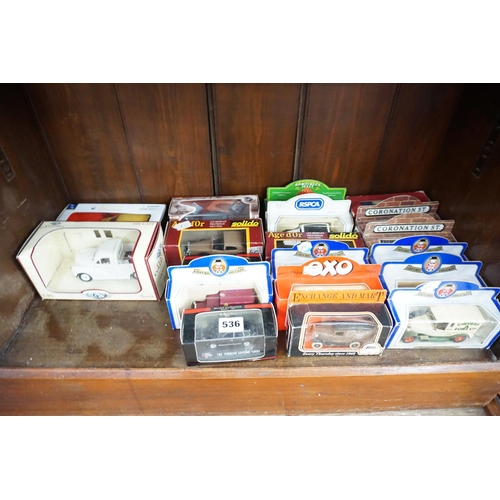 536 - A collection of boxed model vehicles (bottom shelf)
