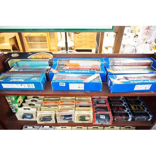 537 - A collection of boxed model lorries (top shelf)