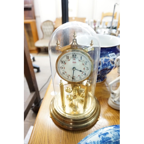 547 - A brass clock within a dome