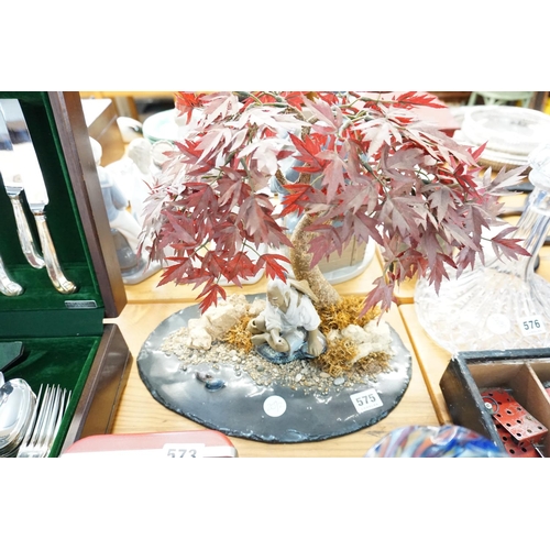 575 - An ornament of a gentleman under an acer tree