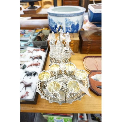 585 - A plated vinaigrette stand with bottles and a plated egg cup stand (handle for repair)