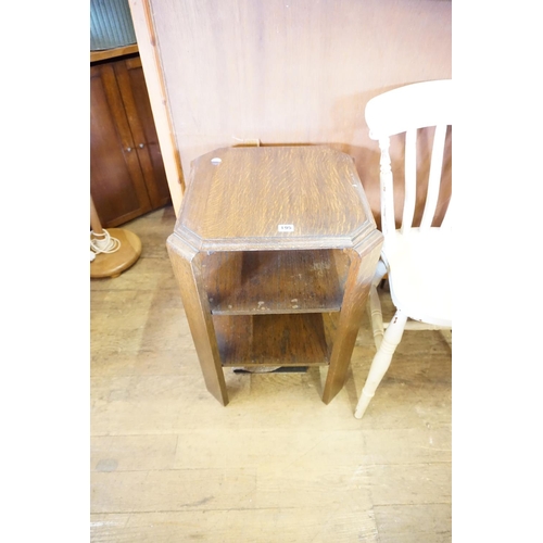 195 - An oak 3 tier occassional table