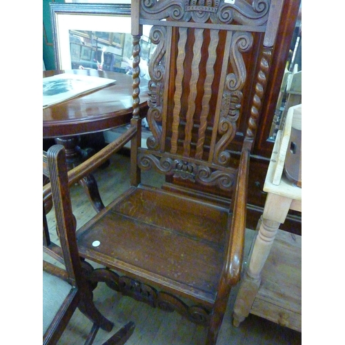 106 - A decorative oak armchair with carved detail