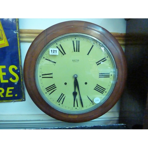 121 - A mahogany cased circular wall clock with painted dial - Smiths of Enfield