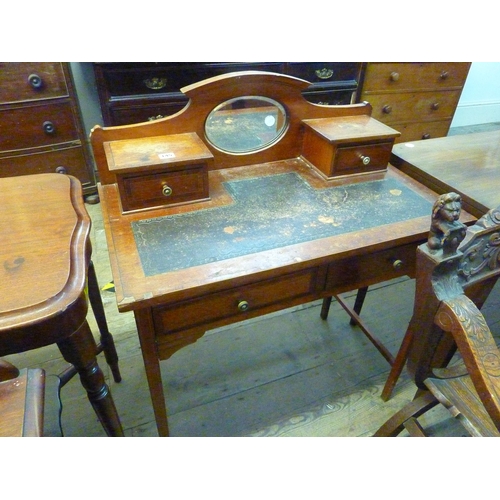 145 - An Edwardian mahogany desk with leather inlay to top