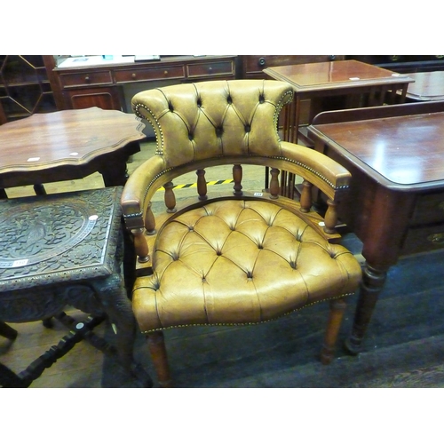 149 - A mahogany and leather upholstered button backed tub chair