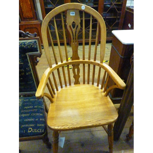 155 - A good quality Wood Bros oak spindle backed Windsor armchair