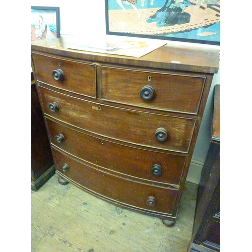 168 - A bow front chest of drawers for restoration