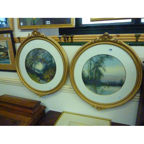 186 - 2 circular watercolours of river scenes in decorative gilded frames