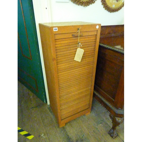 206 - An oak tambour fronted filing cabinet fitted with drawers