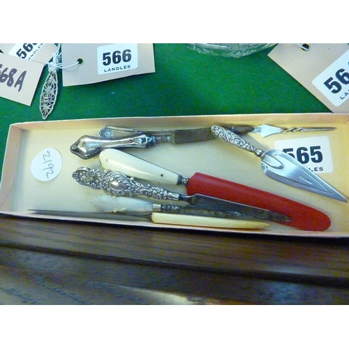 565 - A tray with assorted silver handles and other manicure accessories etc