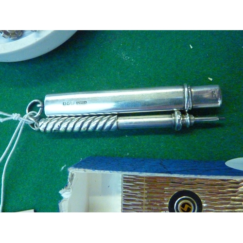 572 - A silver propelling pencil and a silver flat pencil holder