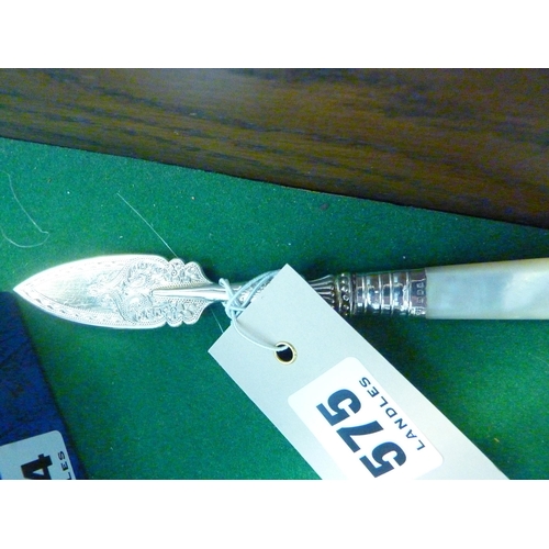 575 - A decorative silver butter knife with pearl handle