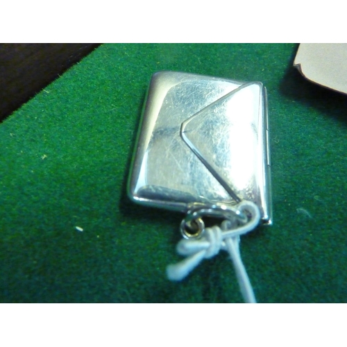 581 - A miniature silver envelope