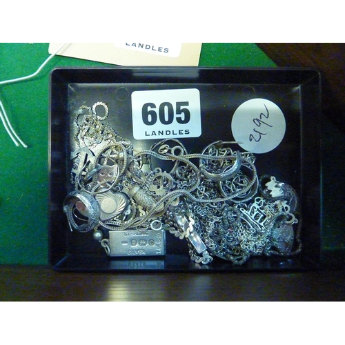 605 - An assortment of silver jewellery