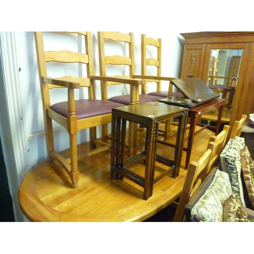 81 - An extending oak dining table with 6 (4 + 2 carvers) oak dining chairs