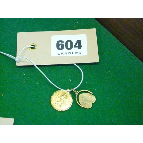 604 - A 9ct gold St Nicholas pendant and a 9ct gold heart pendant