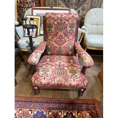 20 - An Edwardian mahogany and upholstered armchair