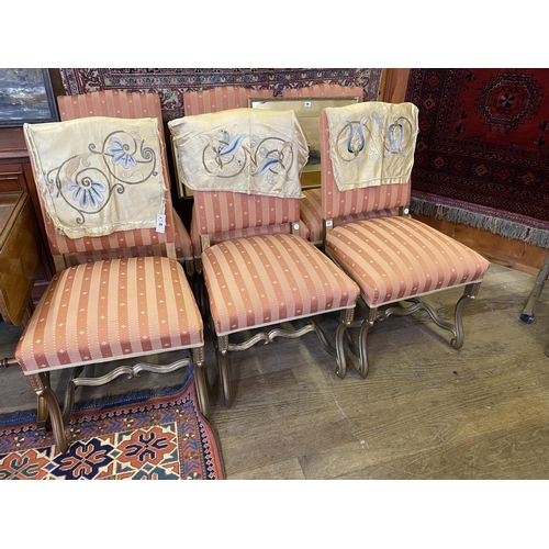 27 - 6 Continental gilded and upholstered dining chairs with scrolled detail to the feet, serpentine stre... 