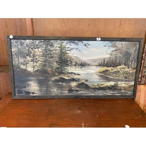 31 - A framed oil painting of a mountainous lakeland scene