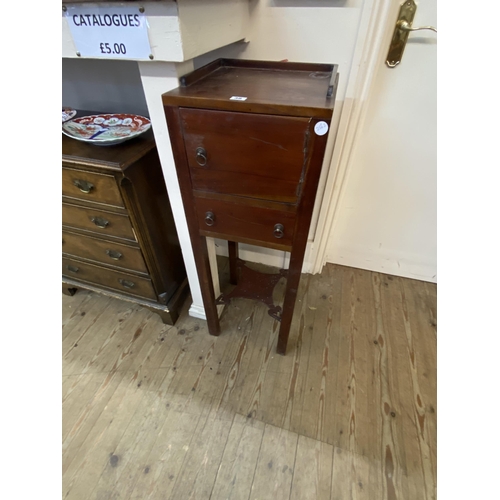 38 - A hardwood arts and crafts style pot cupboard with a lower drawer and gallery to the top, lower stre... 