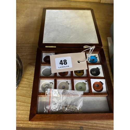 48 - A box of interchangeable necklace pendants