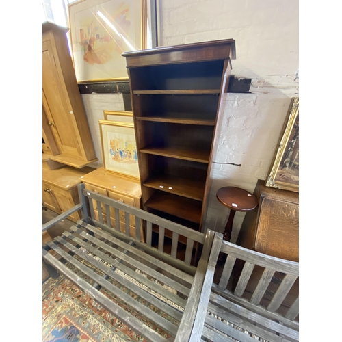 9 - A mahogany freestanding bookcase of tall and narrow proportions with adjustable shelves