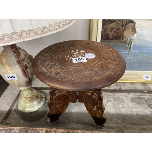 105 - A decorative carved small table