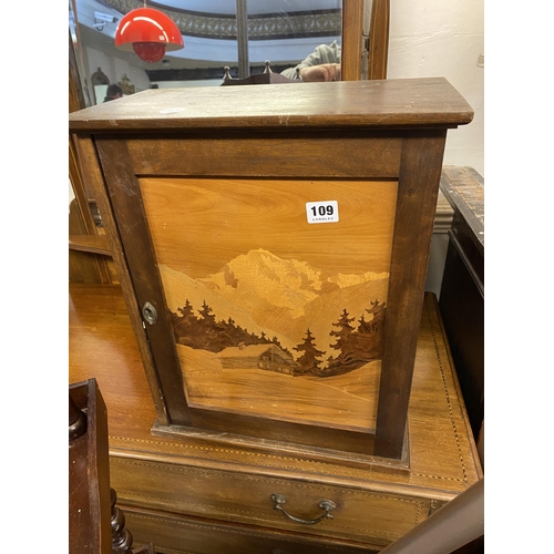 109 - A smokers cabinet with a decoratively inlaid front panel