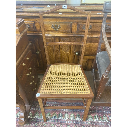 24 - An Edwardian mahogany chair with a split cane seat