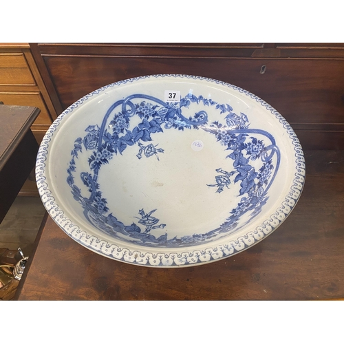 37 - A decorative blue and white water bowl