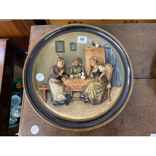 49 - A German earthenware plate with a scene in relief