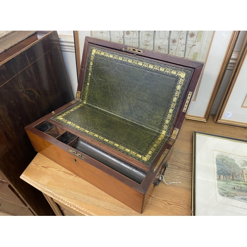 340 - A mahogany writing box with an internal leather slope, brass hinged support, secret drawer and brass... 