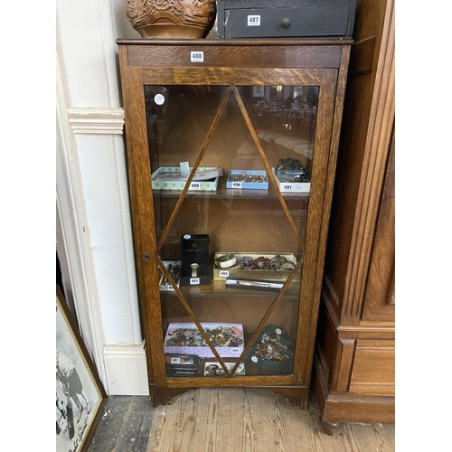 488 - An oak and glazed display cabinet