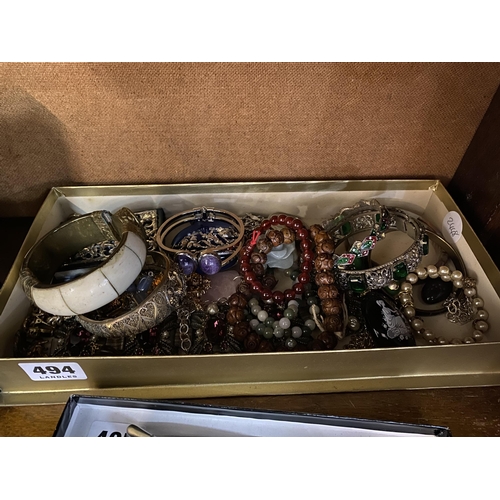 494 - A box of assorted bracelets, bangles etc