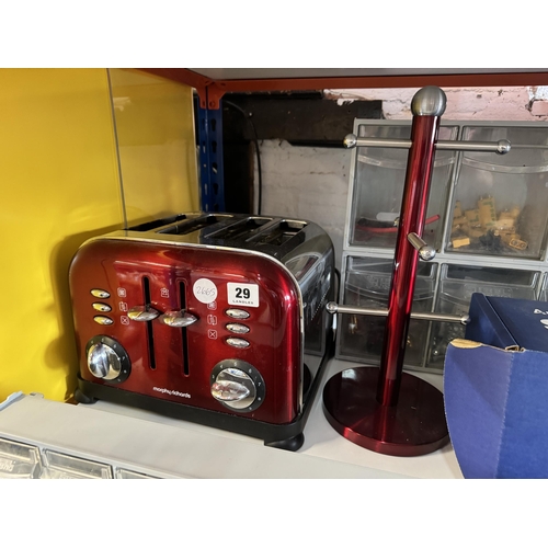 29 - A toaster and a mug stand