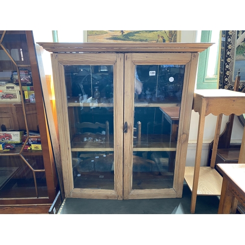 120 - A pitch pine and glazed display cabinet