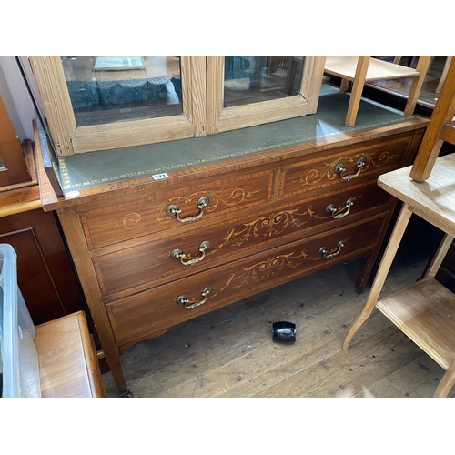 121 - An Edwardian mahogany and inlaid leather topped chest of drawers