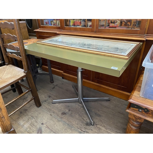 127 - A 1960's formica topped table on a chrome pedestal base