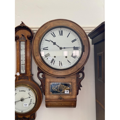 136 - A walnut cased wall clock with inlaid detail, decorative pendulum window, painted dial with Roman nu... 