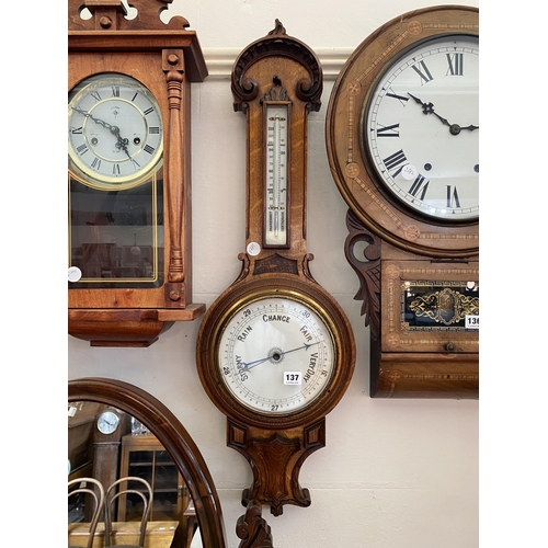 137 - An oak barometer with carved detail