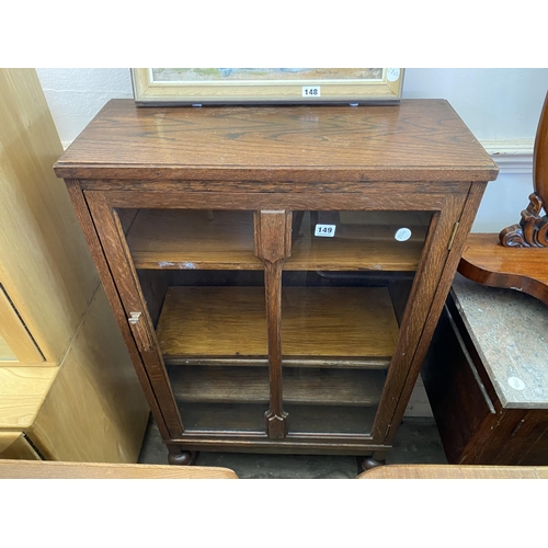 149 - An oak and glazed bookcase