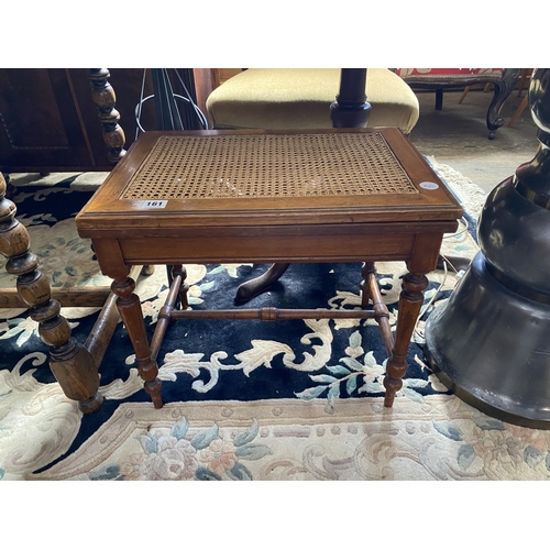 161 - A commode stool with a split cane top and turned stretchers